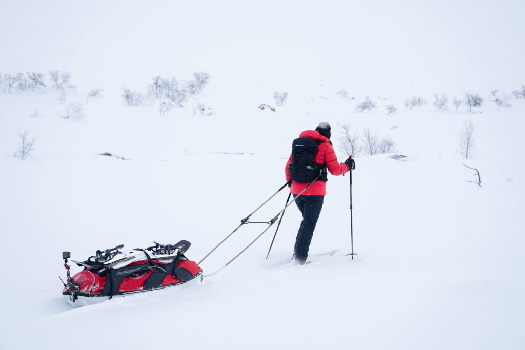 Sara pulling her  gear through the snow on Day 3 of the challenge.   (Photo by Brodie Hood/Comic Relief)